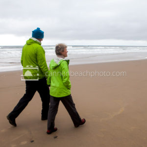 Couple Walking the Shoreline, Oregon Coast