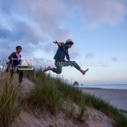 Couple Dune Jumping in Cannon Beach