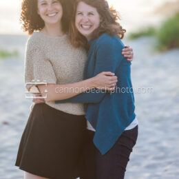Two Sisters Grinning on the Beach