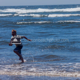 Boy Running in the Ocean