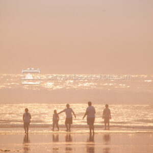 Family Playing at the Ocean on a Dreamy Day